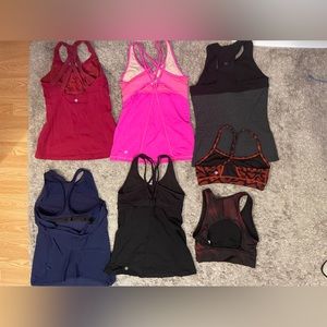 7 Lululemon Athleta Zobha workout tops and sports bras. Great condition free bag
